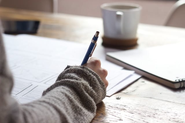 Girl holding a pen